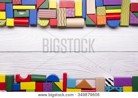 Kids Educational Developing Toys Frame On White Background. Top View. Flat Lay. Copy Space For Text