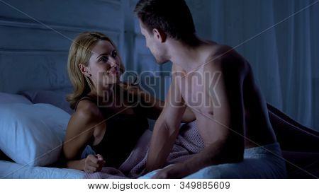 Happy Lovers Looking At Each Other, Lying In Bed, Sexologist Therapy, Desire