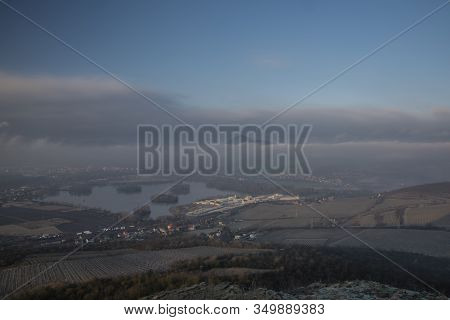 Sunrise Time On Radobyl Hill Over Valley Of River Labe And Lovosice Town