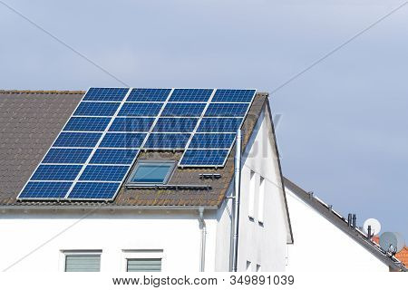 Solar Panels On The Tiled Roof Of A Private House. Renewable Clean Green Energy Saving Efficient Pho