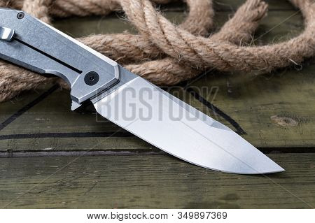 Knife And Steel Handle. Knife At An Angle Close Up.