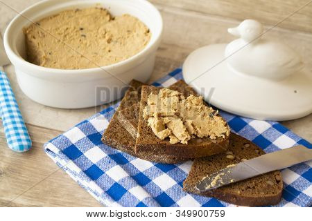The Pate Of Duck With Bread On Kitchen Table.