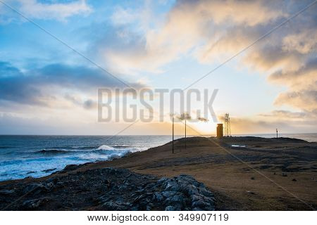 The Lighthouse Of Hvalnes In East Iceland With The Atlantic Ocean In The Background