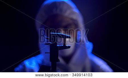 Forensic Expert Measuring Bullet Caliber, Searching For Conclusive Evidence