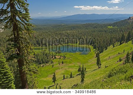 Expansive Mountain Panorama Of An Alpine Crumbaugh Lake In Lassen Volcanic National Park In Californ