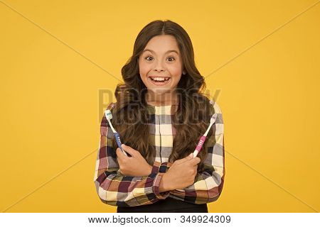 Make Sure To Brush Tooth. Happy Girl Hold Tooth Brushes. Little Child With Healthy Smile. Tooth Dent
