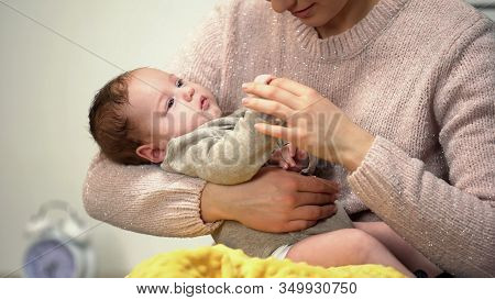 Newborn Baby Holding Mothers Finger Lying In Mothers Arms, Loving Relation