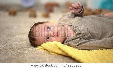 Adorable Little Baby Lying, Birth Statistics And Governmental Children Aid