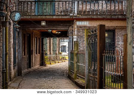 Gonzalez Catan, Argentina, September 28, 2019: Cobblestone Path Through Abandoned Buildings In The A