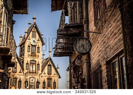 Gonzalez Catan, Argentina, September 28, 2019: Very Old Watch Hanging From A Brick Wall Of Abandoned