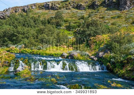 Waterfall In Gjain In Thjorsardalur Valley In South Iceland On A Sunny Summer Day