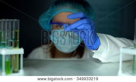 Researcher Taking Ampule With Transparent Liquid From Refrigerator, Vaccination