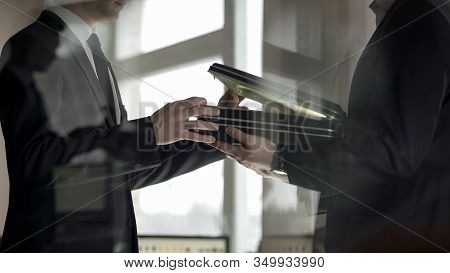 Businessman Checking Dollars In Briefcase, Kickback In Illegal Cooperation