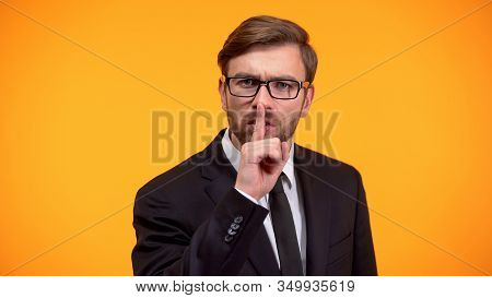 Serious Male Showing Silence Gesture, Nondisclosure Of Personal Data, Secret