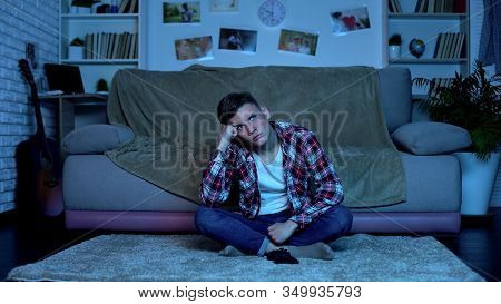 Alone Boy Sitting On Floor Of Room Watching Tv, Lack Of Friends, Boredom