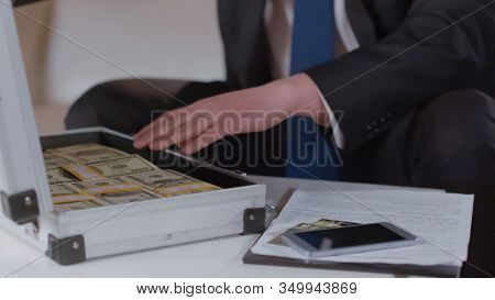 Male Hand In Suit Checking Money In Case, Kickback For Secret Business Agreement