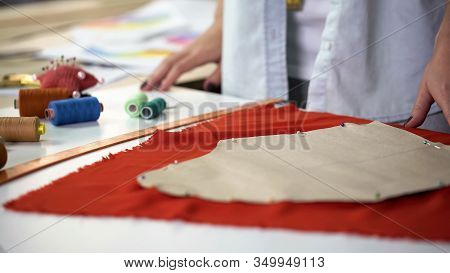Rookie Tailor Ineptly Attaching Pattern To Fabric, Practice At Sewing Enterprise