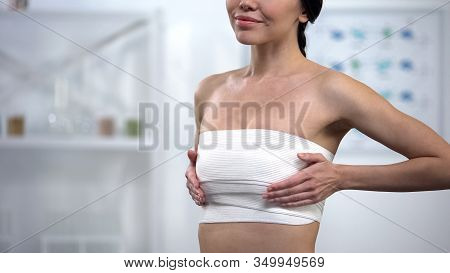 Pleased Woman In Elasto-fit Compression Enjoying Result Of Mammoplasty, Surgery