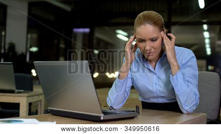 Female Rubbing Temples, Feeling Headache During Night Shift In Office, Overhours