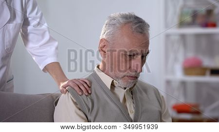 Nurse Supporting Depressed Pensioner In Rehabilitation Center, Benevolence