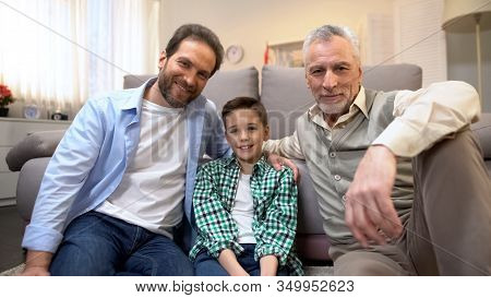 Multiage Male Family Members Looking To Camera, Family Demography Statistics