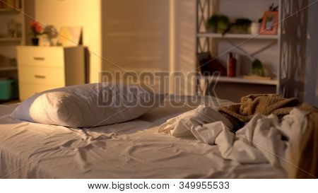 Messy Bed, White Pillow With Blanket Lying On Bed Unmade, Oversleeping Concept