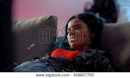 Unconscious Junkie Girl Mouth Foaming At Party In Night Club, Indifferent People