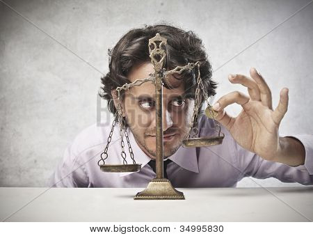 Podnikatel dát minci na rovnováhu