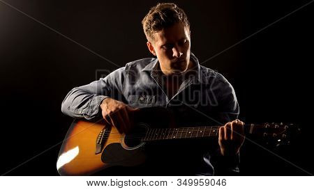 Young Man Playing Romantic Ballad On Guitar, Acoustic Performance, Concert