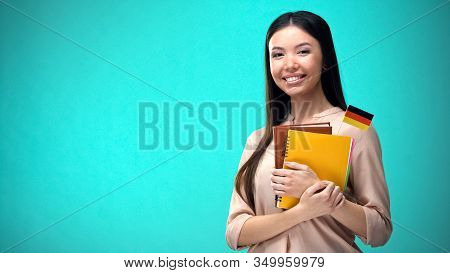 Cheerful Woman Holding German Flag Book, Education Abroad, Learning Language