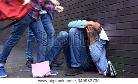 Cruel Teenagers Scattering Classbooks Of Afro-american Boy, School Bullying