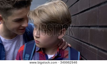 Cruel Teenage Boy Threatening Depressed Student, Verbal Abuse, Intimidation