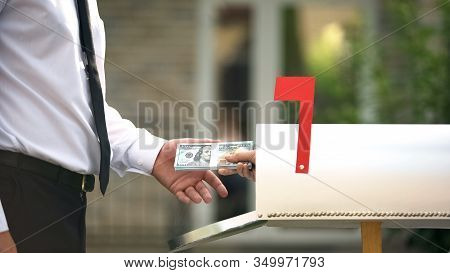 Man Receiving Dollars From Mailbox, Using Transfer Service, Financial Operations