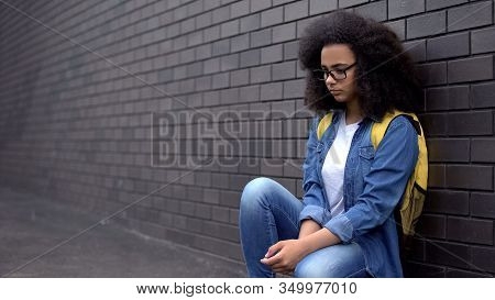 Unhappy African School Girl Sitting Campus, Puberty Age Loneliness, Insecurities