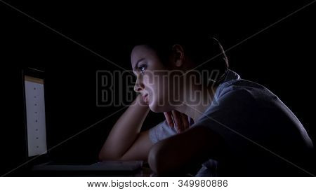 Bored Girl Working On Laptop At Night, Difficult To Concentrate, Procrastination