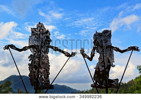 Bali, Indonesia - October 16, 2016: Black Shadow Silhouette Of Old Traditional Puppets Of Bali And J