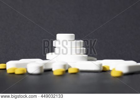Ladder From White Pills On A Gray Background. Pharmaceutical Business Concept