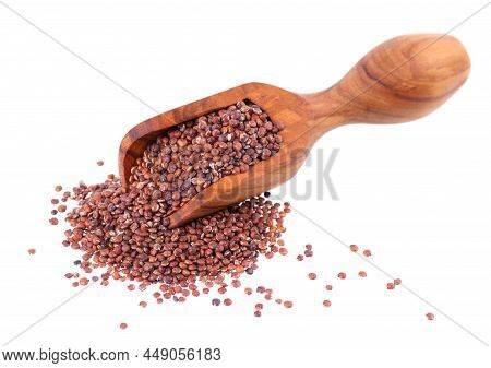 Red Quinoa Seeds In Wooden Scoop, Isolated On White Background. Pile Of Raw Kinwa.