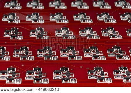 Close-up Of A Red Electronic Circuit Board With Many Smd Components. Complex Logical Electronic Syst