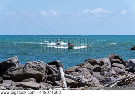 Whakatane New Zealand - January 30 2022; Small Boats Speed Toward Whakatane Entrance Bar When Homewa