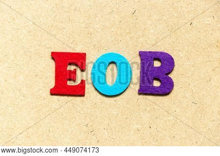 Color Cloth Alphabet Letter In Word Eob (abbreviation Of End Of Business) On Wood Background