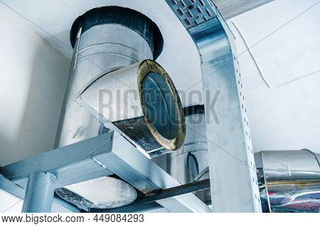 Fragment Of A Chimney. Stainless Steel Ventilation Duct In An Industrial Boiler Room. Installation O