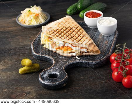 Pita Shawerma With Vegetables And Yogurt Sauce On Dark Wooden Background. Levantine Cuisine