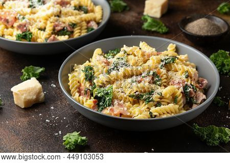 Fusilli Pasta With Bacon, Kale And Parmesan Cheese. Healthy Food