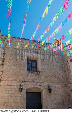 Oaxaca, Oaxaca, Mexico- December 25, 2021: Antique Building Made Of Green Quarry, Decorated With Col
