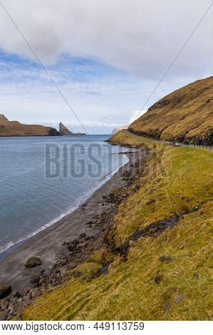 View Of The Road Along The Coast On The Island Of Vagar. Mountain Landscape. Bour On Vagar Island. F