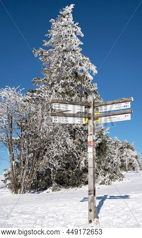 Winterberg, Germany - February 13, 2021: Hiking Trail During Winter With Focus On The Waymark On Feb