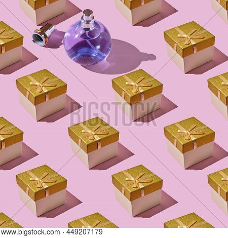 Gift Box Decorated With Golden Bow And A Bottle Of Perfume. Composition Made From Glass Perfume Bott