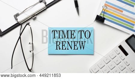 Stickers With Chart,calculator And Paper With Text Time To Renew On The White Background