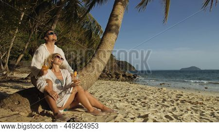 Loving Couple In White Dress And Sunglasses, Near Palm Tree, Rel
